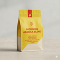 Yellow coffee bag labeled 'Morning Arabica Blend' on a light gray background